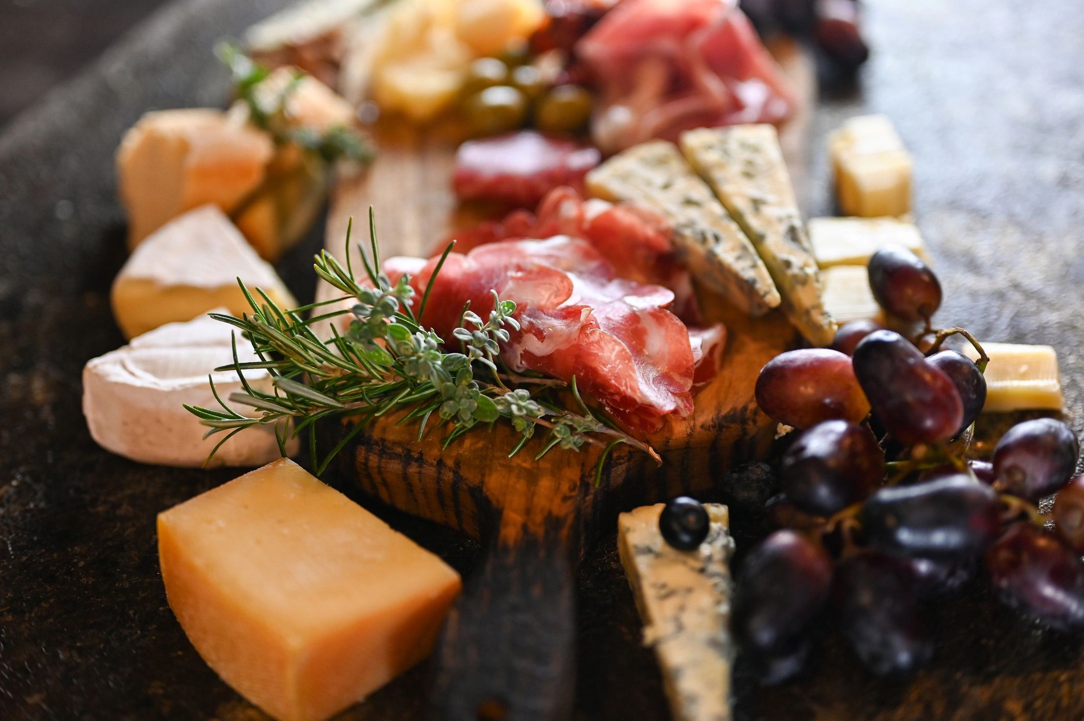 Finished charcuterie board styled with food